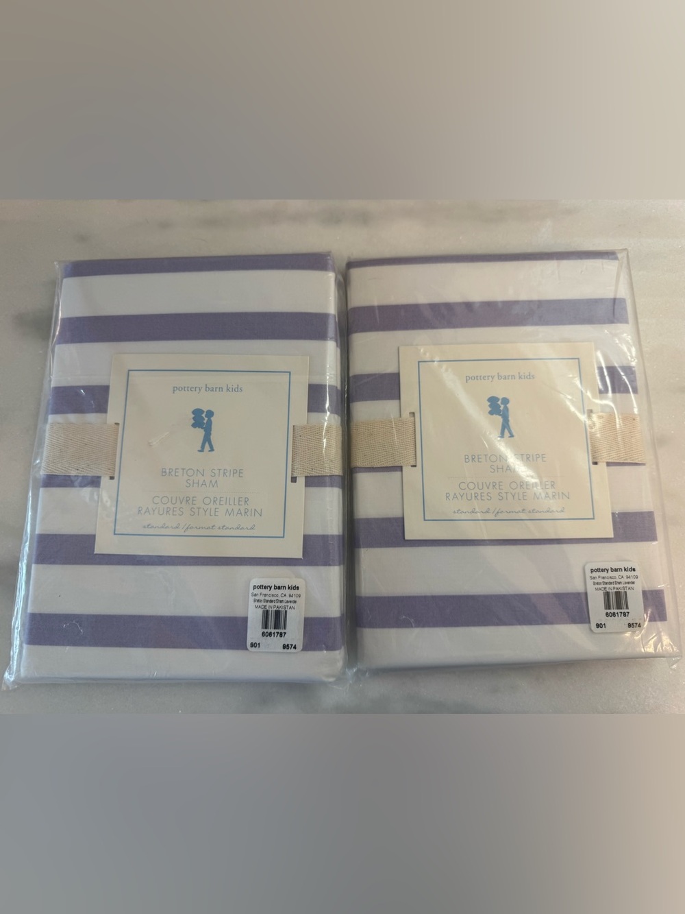 2 Pottery Barn Kids Breton Stripe Standard Shams in the color lavender.